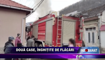 Două case, înghițite de flăcări