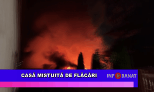 Casă mistuită de flăcări