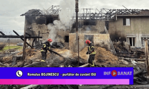 Casă distrusă de flăcări