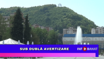 Sub dublă avertizare
